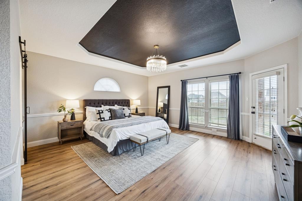 3608 Acropolis Way Plano, TX 75074 - Photo 13 of 40 a bed room with a bed mirror and a window