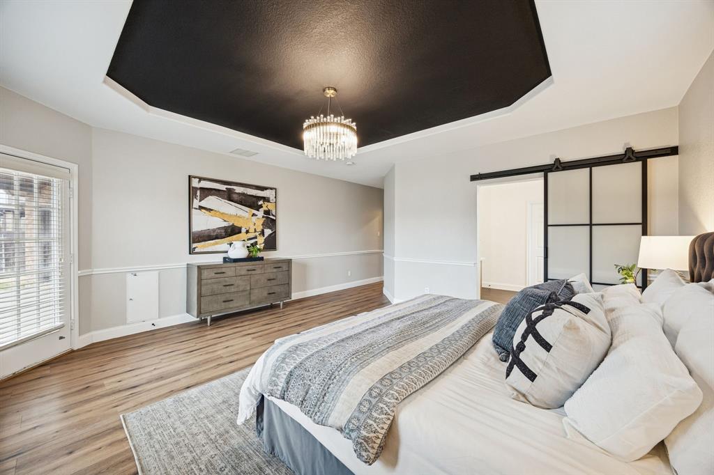 3608 Acropolis Way Plano, TX 75074 - Photo 15 of 40 a bed room with a bed mirror and a window