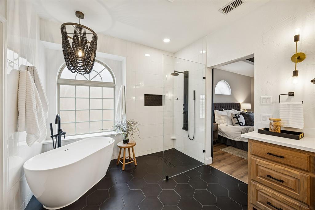3608 Acropolis Way Plano, TX 75074 - Photo 16 of 40 a bathroom with a bathtub sink and mirror