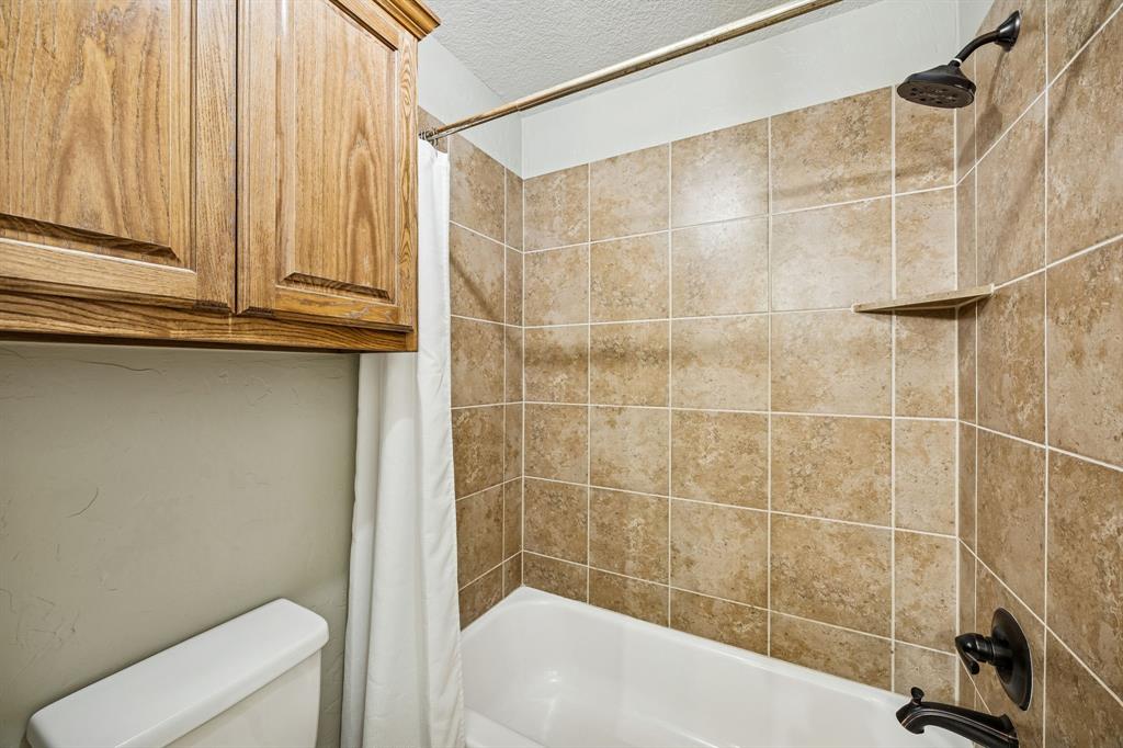3608 Acropolis Way Plano, TX 75074 - Photo 28 of 40 a bathroom with a bathtub and shower