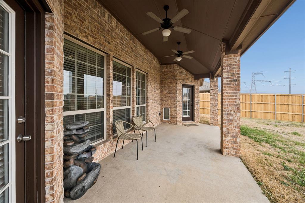 3608 Acropolis Way Plano, TX 75074 - Photo 33 of 40 a view of a porch with furniture and floor to ceiling window