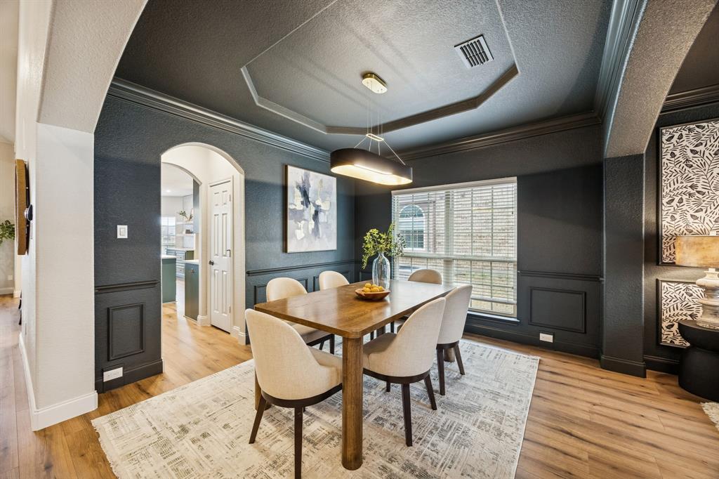 3608 Acropolis Way Plano, TX 75074 - Photo 6 of 40 a dining room with furniture and wooden floor