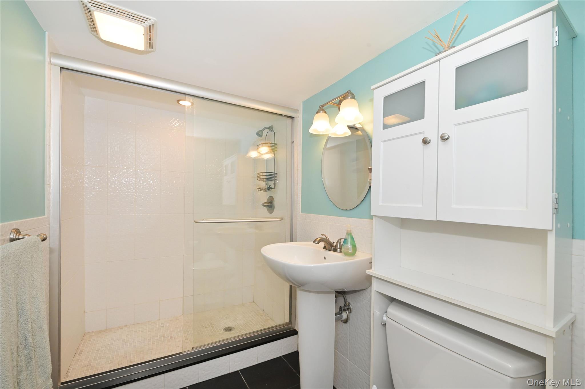 3485 Riverside Drive Oceanside, NY 11572 - Photo 25 of 30 Full bath with a stall shower, and tile walls