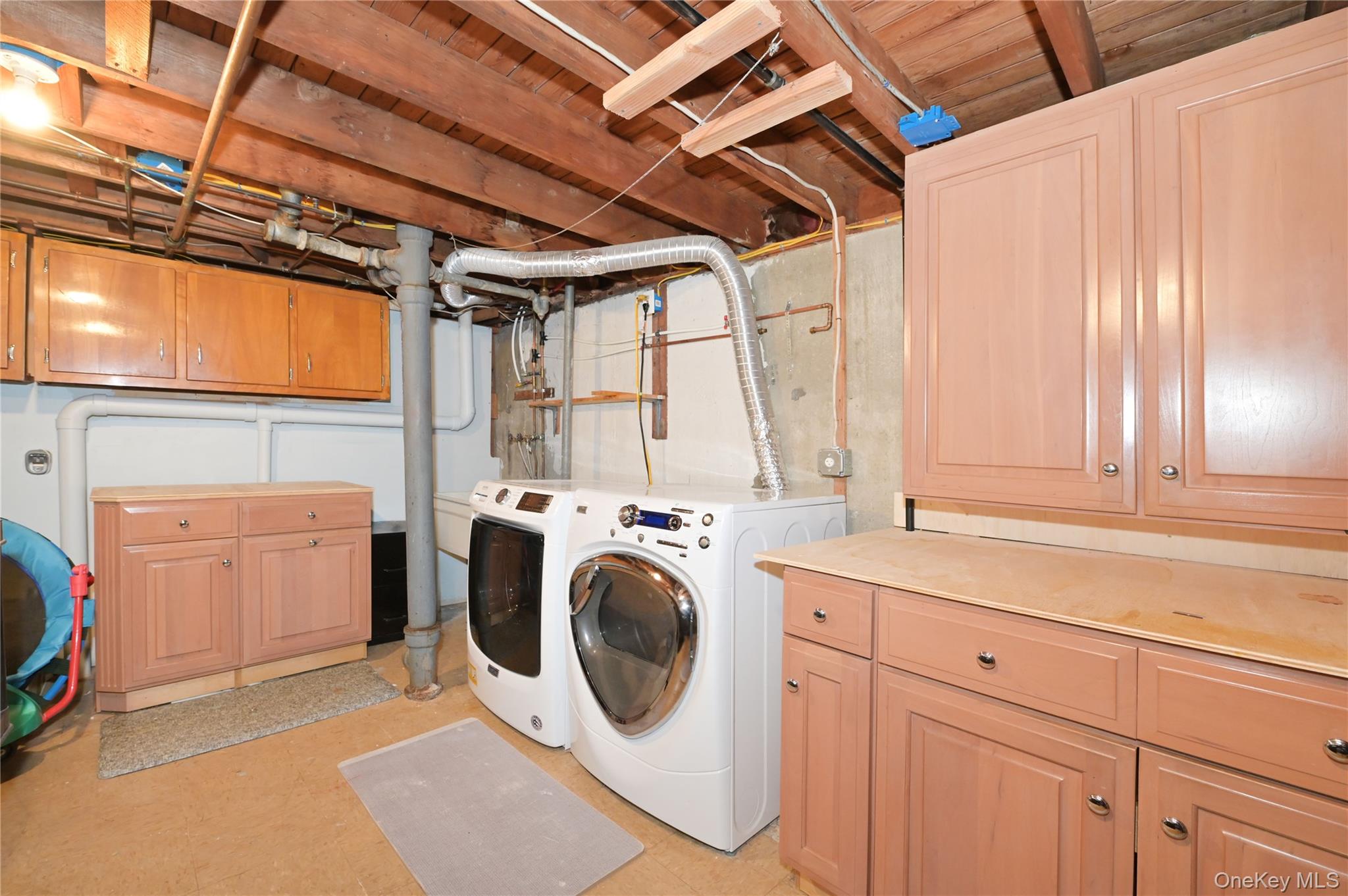 3485 Riverside Drive Oceanside, NY 11572 - Photo 27 of 30 Laundry room with cabinet space and separate washer and dryer
