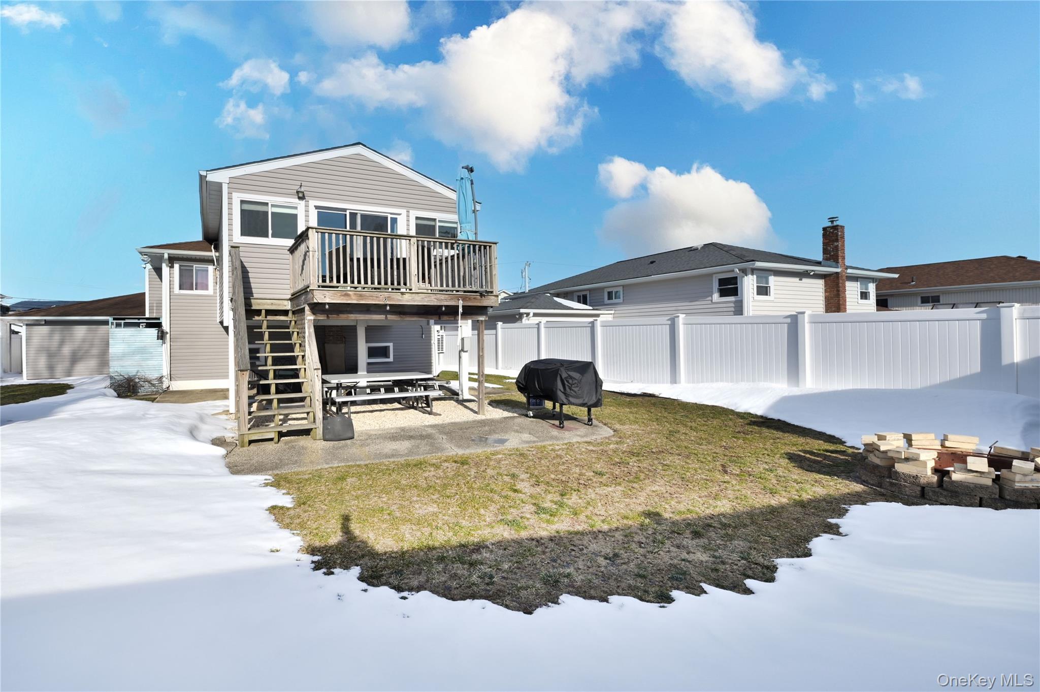 3485 Riverside Drive Oceanside, NY 11572 - Photo 30 of 30 Rear view of property featuring a patio, a deck, and a fenced backyard