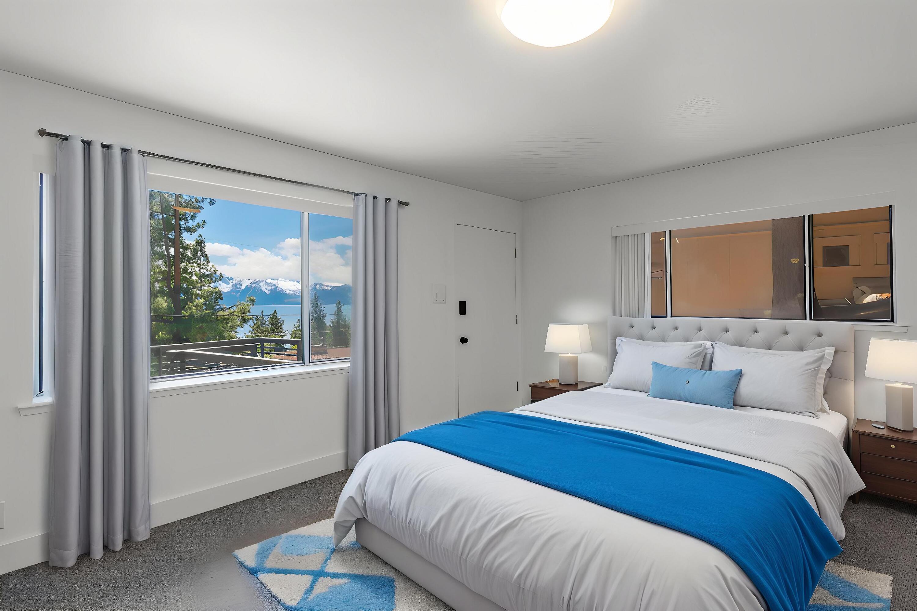 633 Don Drive Zephyr Cove, NV 89448 - Photo 26 of 38 a bedroom with a large bed and a window