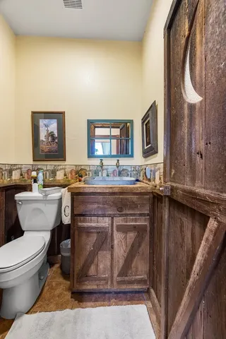 a living room with furniture a rug and a chandelier