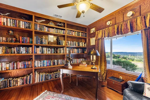 a spacious bedroom with a large bed and a dresser