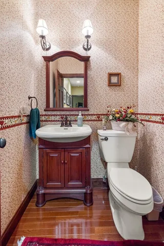 a spacious bedroom with a bed and a flat screen tv