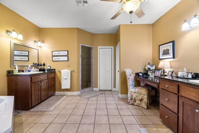 a living room with furniture and a dining table
