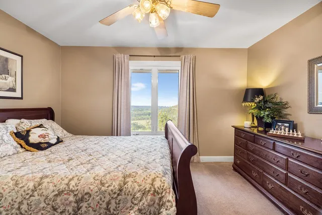 a bathroom with a granite countertop sink double and mirror