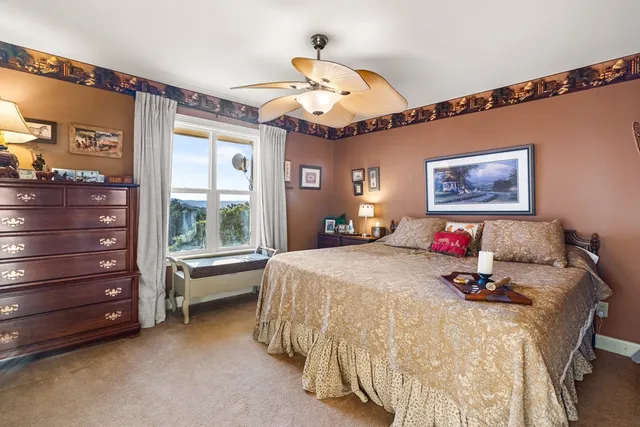 aerial view of a house with a yard