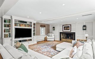 60 Washington Street, Unit 60 Sherborn, MA 01770 - Photo 7 of 15 a living room with furniture flat screen tv and a fireplace