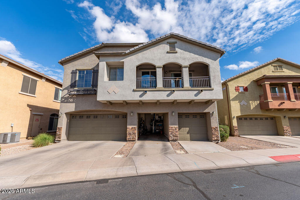 2024 South Baldwin, Unit 64 Mesa, AZ 85209 - Photo 2 of 25 a front view of a house with a yard