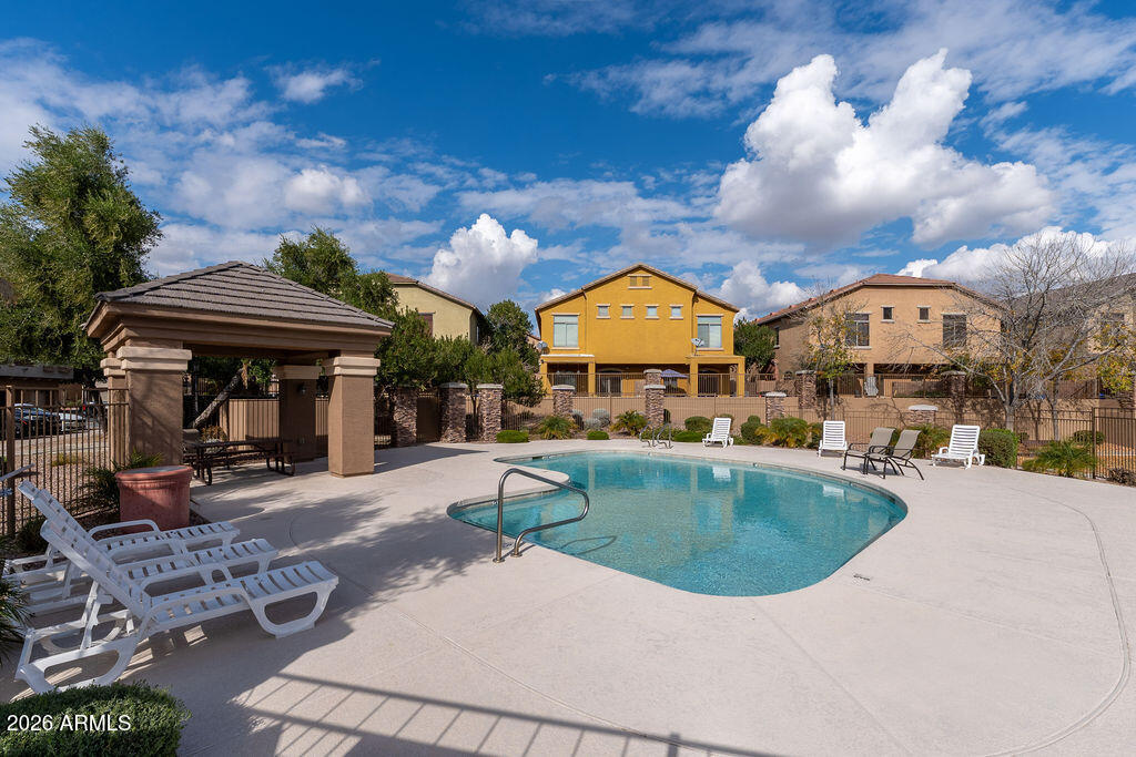 2024 South Baldwin, Unit 64 Mesa, AZ 85209 - Photo 21 of 25 an outdoor space with swimming pool and furniture