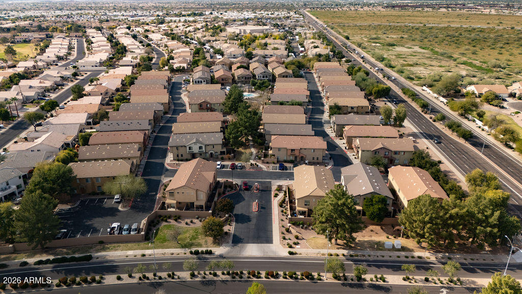 2024 South Baldwin, Unit 64 Mesa, AZ 85209 - Photo 23 of 25 an aerial view of residential houses with outdoor space