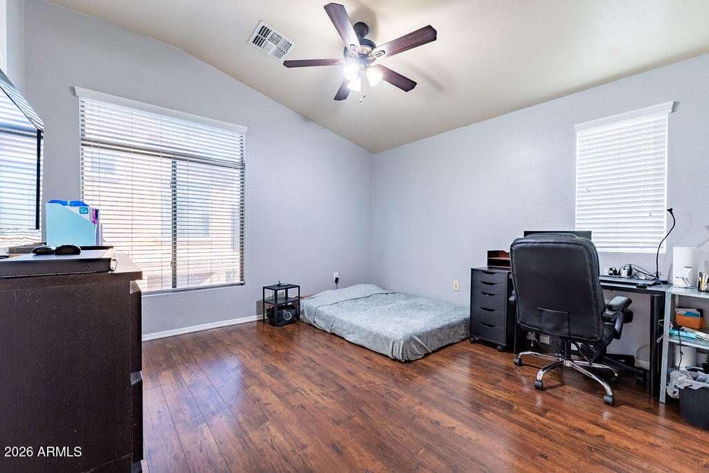2024 South Baldwin, Unit 64 Mesa, AZ 85209 - Photo 10 of 25 a bedroom with bed and wooden floor