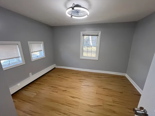 a view of an empty room with a window