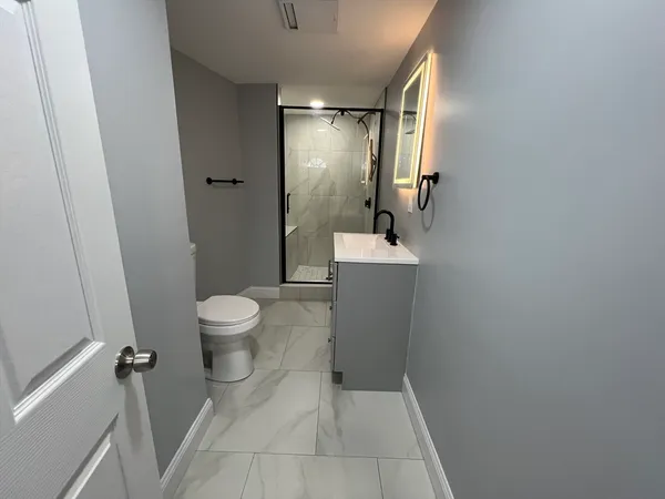 a bathroom with a sink and mirror