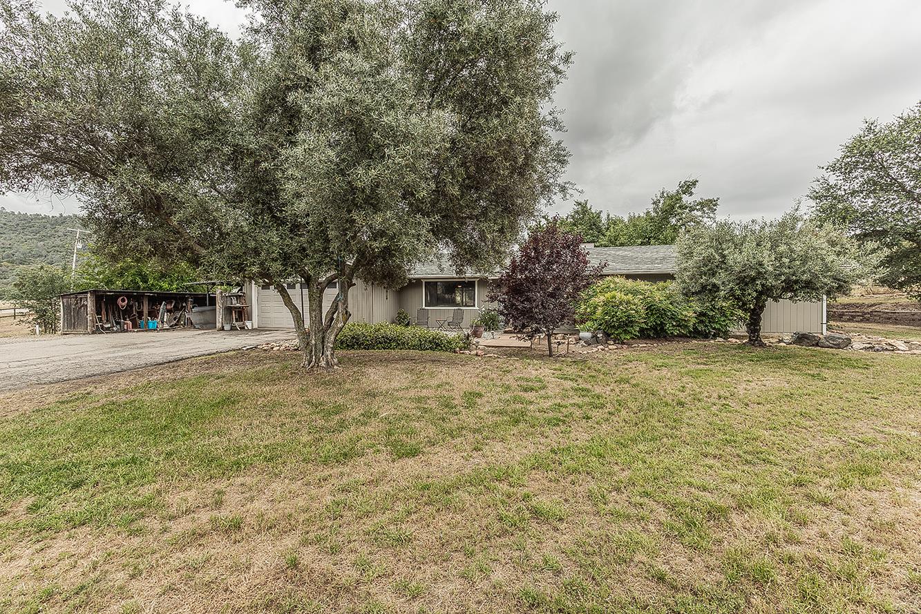29545 Oak Meadow Road Tollhouse, CA 93667 - Photo 49 of 69 a front view of a house with a yard