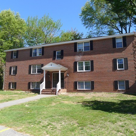 21 Folly Mill Road, Unit 2B Seabrook, NH 03874 - Photo 1 of 9 a front view of a house with a yard