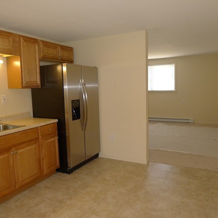 21 Folly Mill Road, Unit 2B Seabrook, NH 03874 - Photo 4 of 9 a view of a refrigerator in kitchen and a window