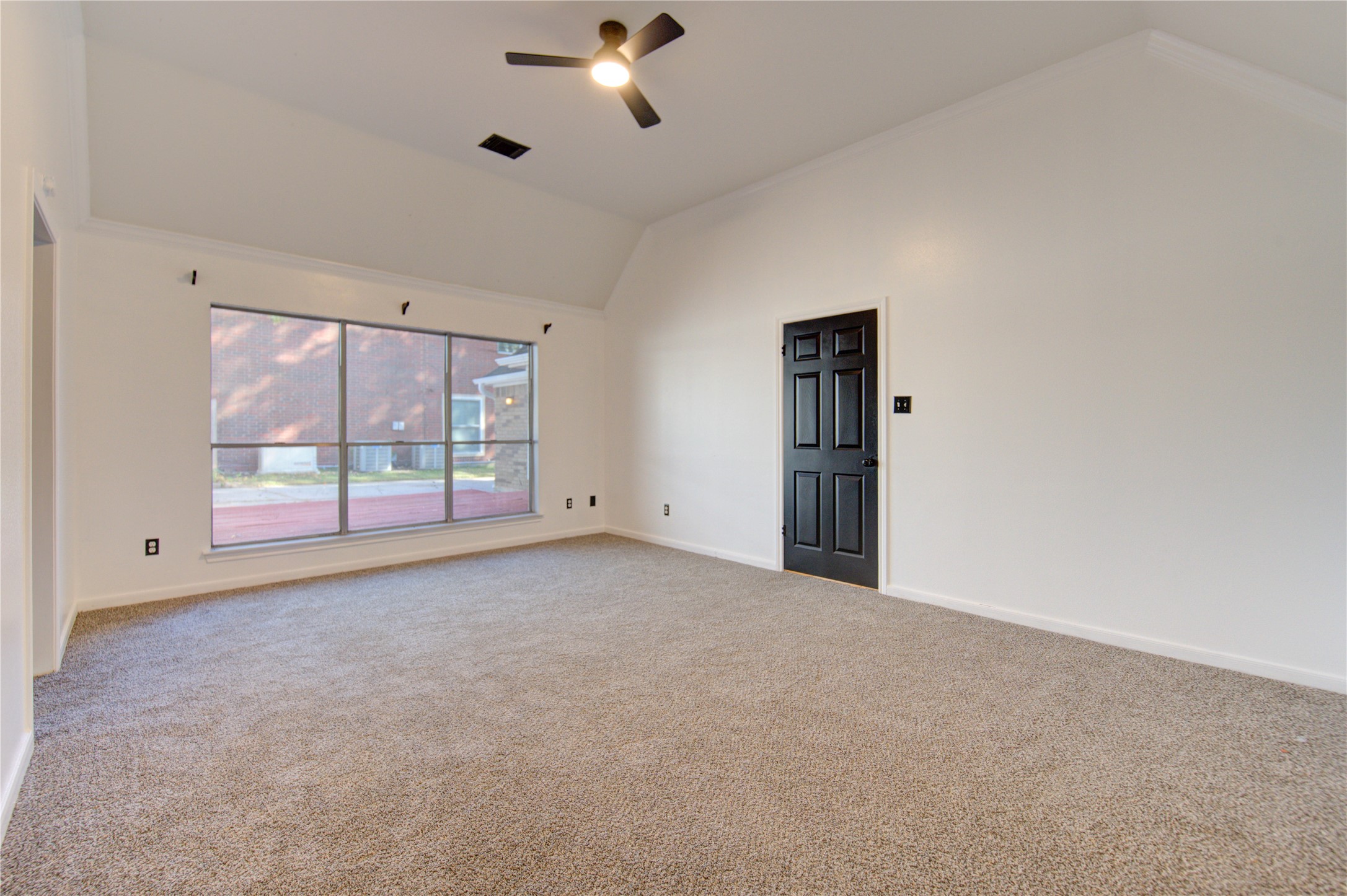 5931 Thom Road Humble, TX 77346 - Photo 12 of 18 a view of an empty room with a window
