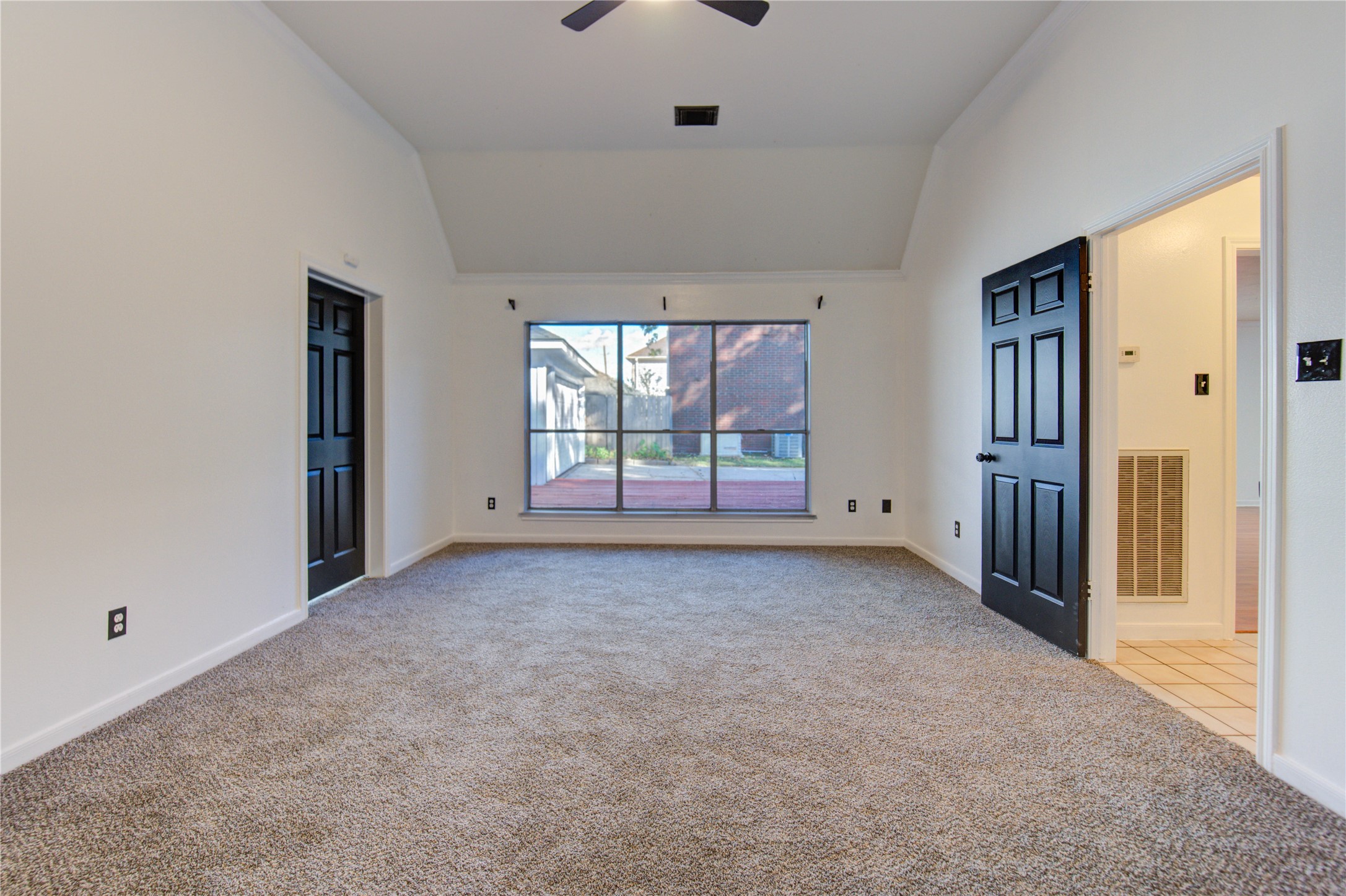 5931 Thom Road Humble, TX 77346 - Photo 13 of 18 an empty room with windows