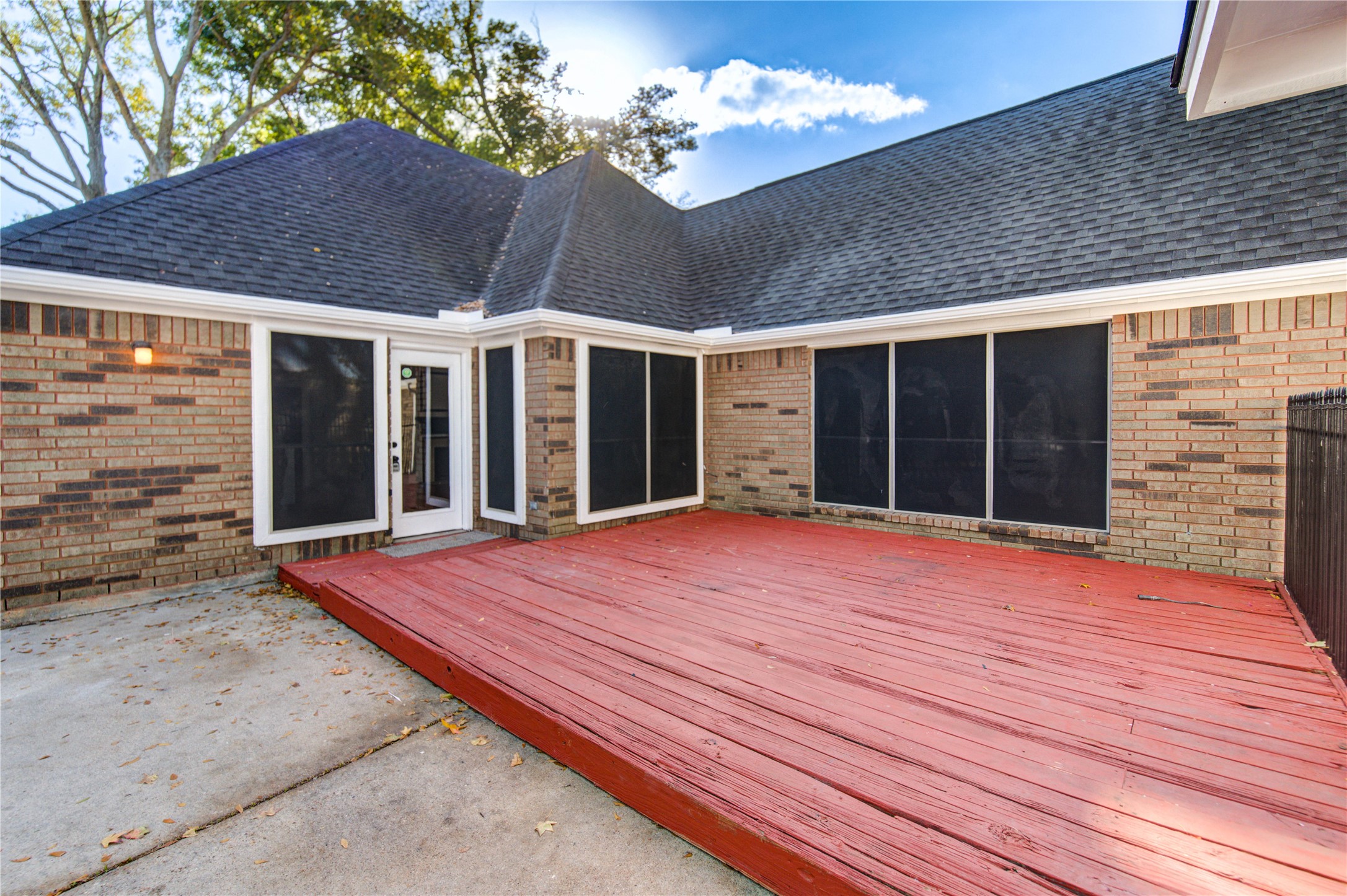 5931 Thom Road Humble, TX 77346 - Photo 17 of 18 a view of an house with backyard and balcony