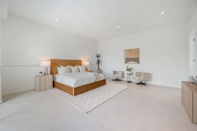 a bedroom with a bed and a couch