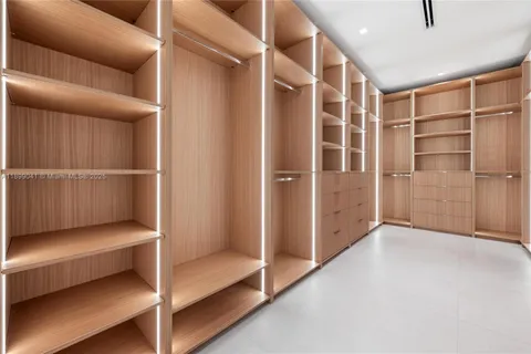 a view of an empty room with a staircase