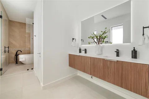 a bathroom with a bathtub and a sink