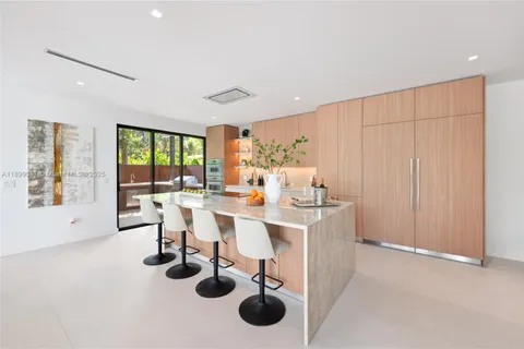 a very nice looking dining room with a table and chairs