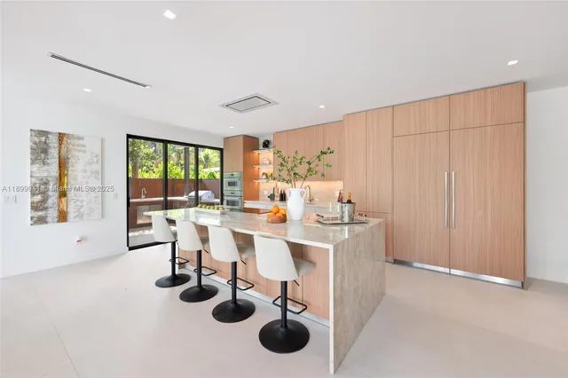 a very nice looking dining room with a table and chairs
