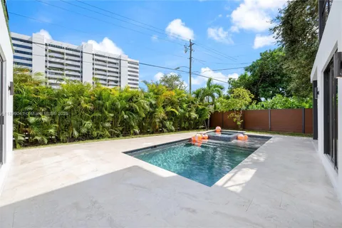 a view of a backyard with plants