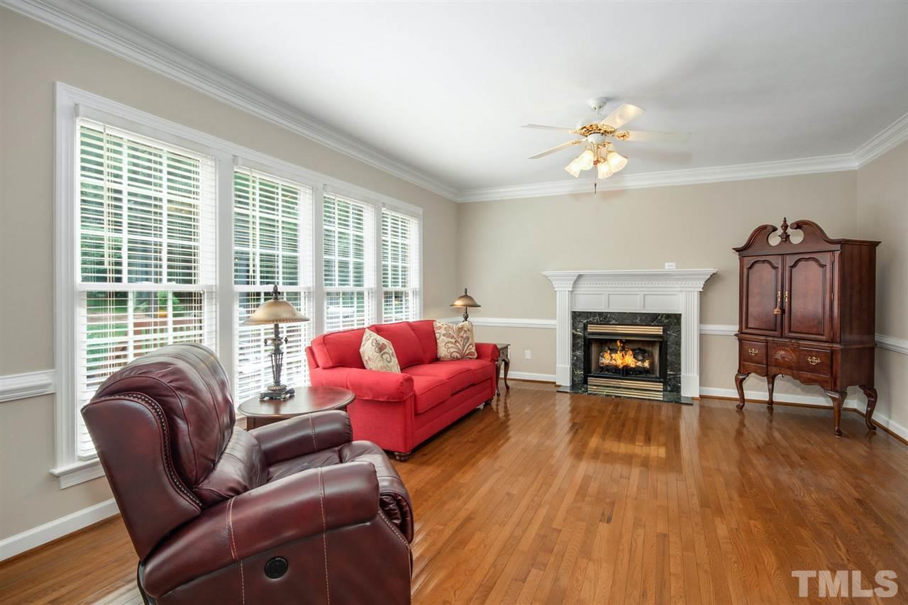 3920 Lauriston Road Raleigh, NC 27616 - Photo 11 of 27 a living room with furniture and a fireplace