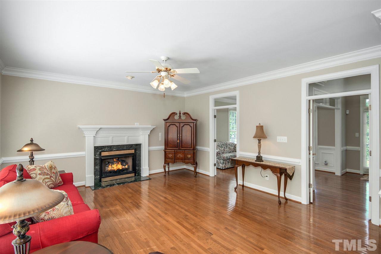 3920 Lauriston Road Raleigh, NC 27616 - Photo 12 of 27 a living room with furniture and a fireplace
