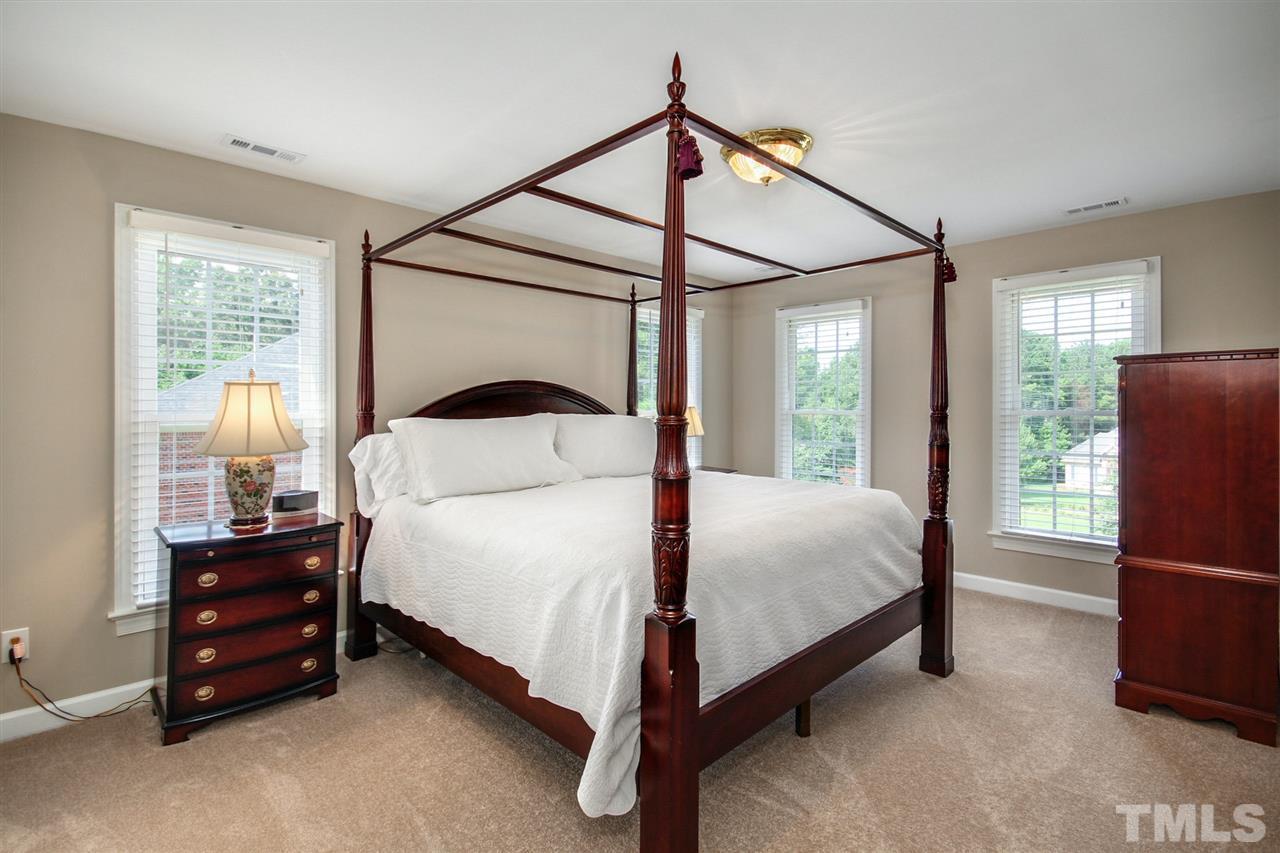 3920 Lauriston Road Raleigh, NC 27616 - Photo 14 of 27 a bedroom with a bed and a window