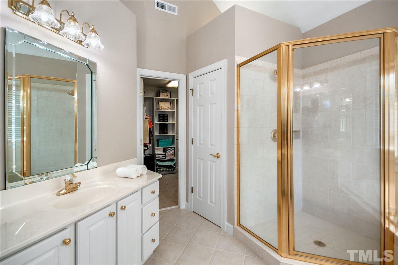 3920 Lauriston Road Raleigh, NC 27616 - Photo 16 of 27 a bathroom with a sink and a mirror