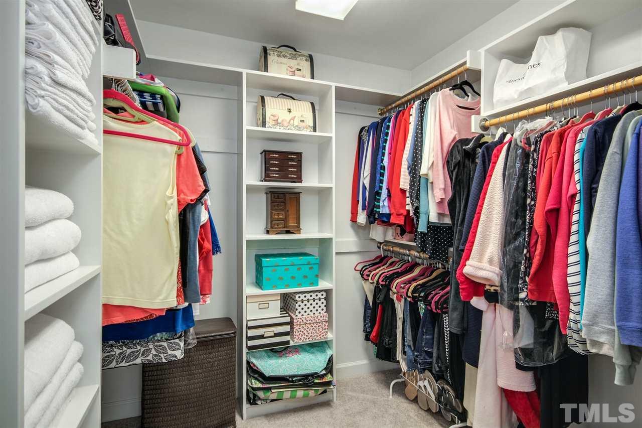 3920 Lauriston Road Raleigh, NC 27616 - Photo 17 of 27 a view of walk in closet with clothes and shoes