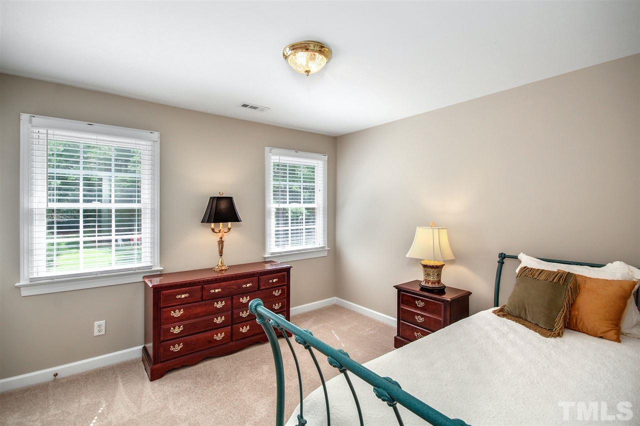 3920 Lauriston Road Raleigh, NC 27616 - Photo 19 of 27 a bedroom with a bed and a window