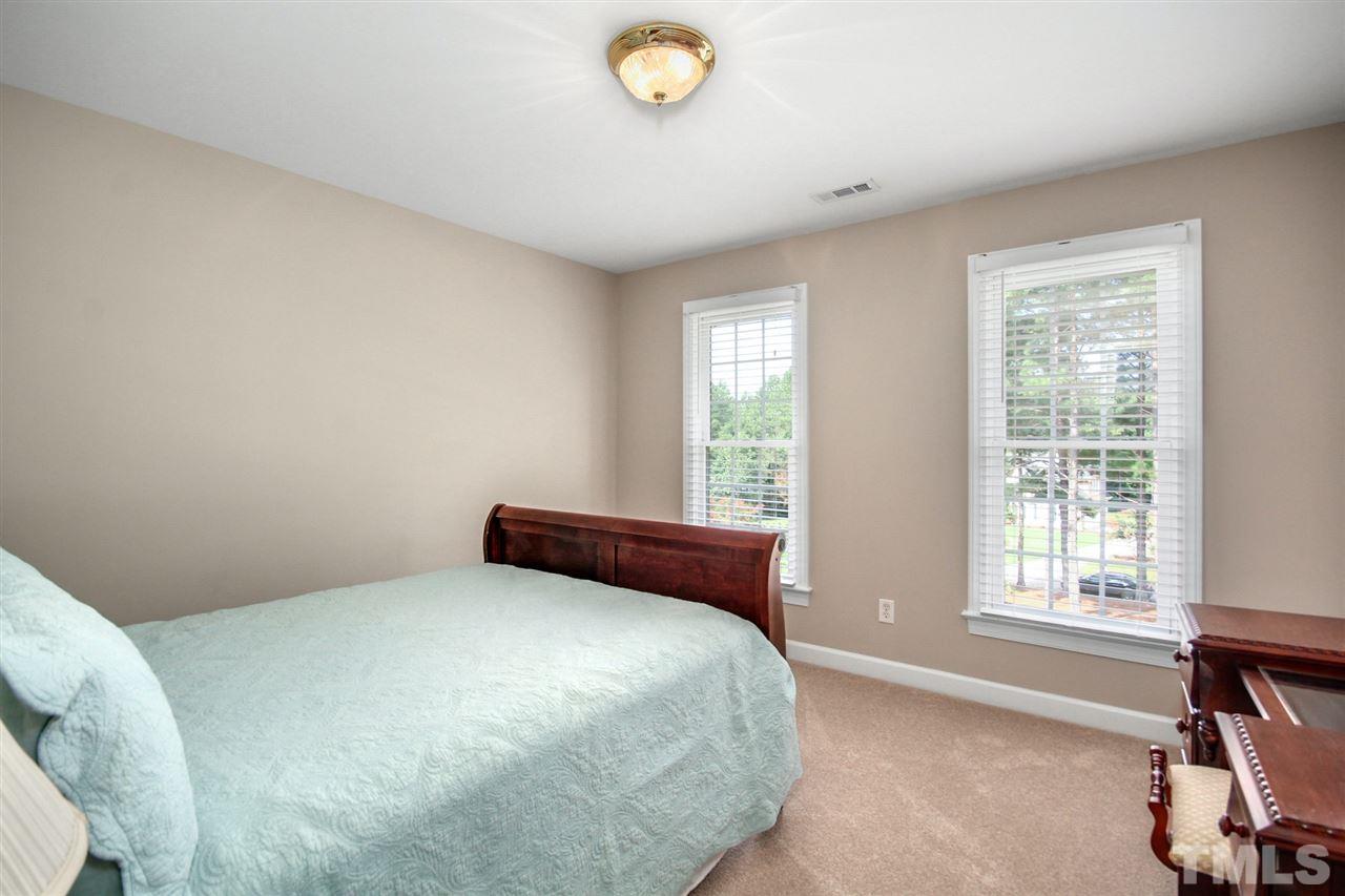 3920 Lauriston Road Raleigh, NC 27616 - Photo 20 of 27 a bedroom with a bed and a window