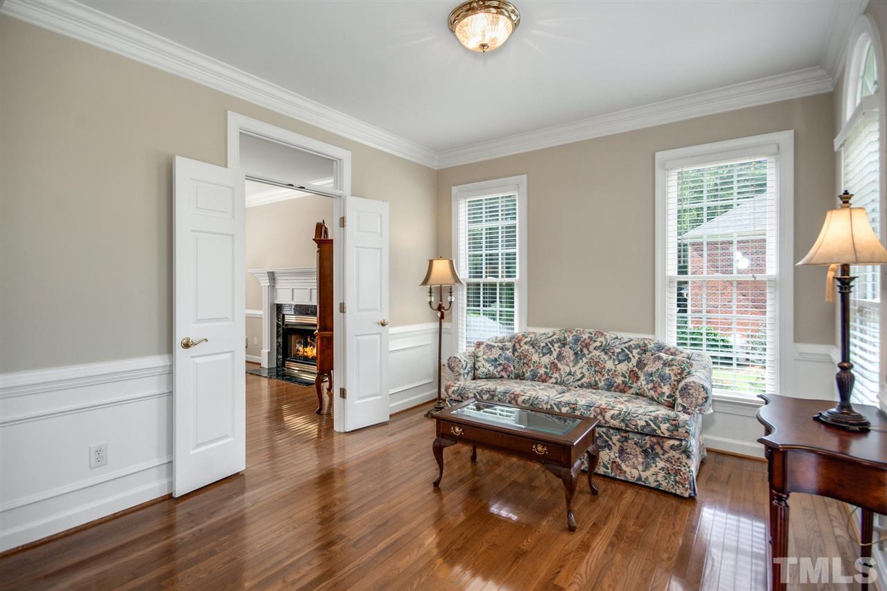 3920 Lauriston Road Raleigh, NC 27616 - Photo 5 of 27 a living room with furniture and a flat screen tv