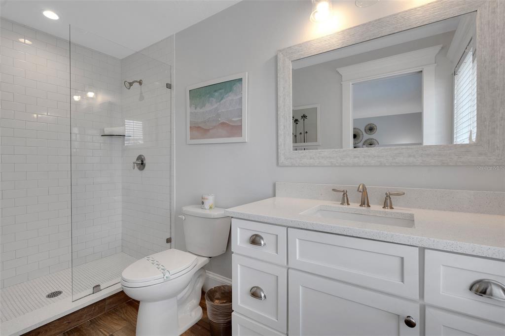 538 Canal Road Sarasota, FL 34242 - Photo 11 of 49 a bathroom with a sink a toilet and shower