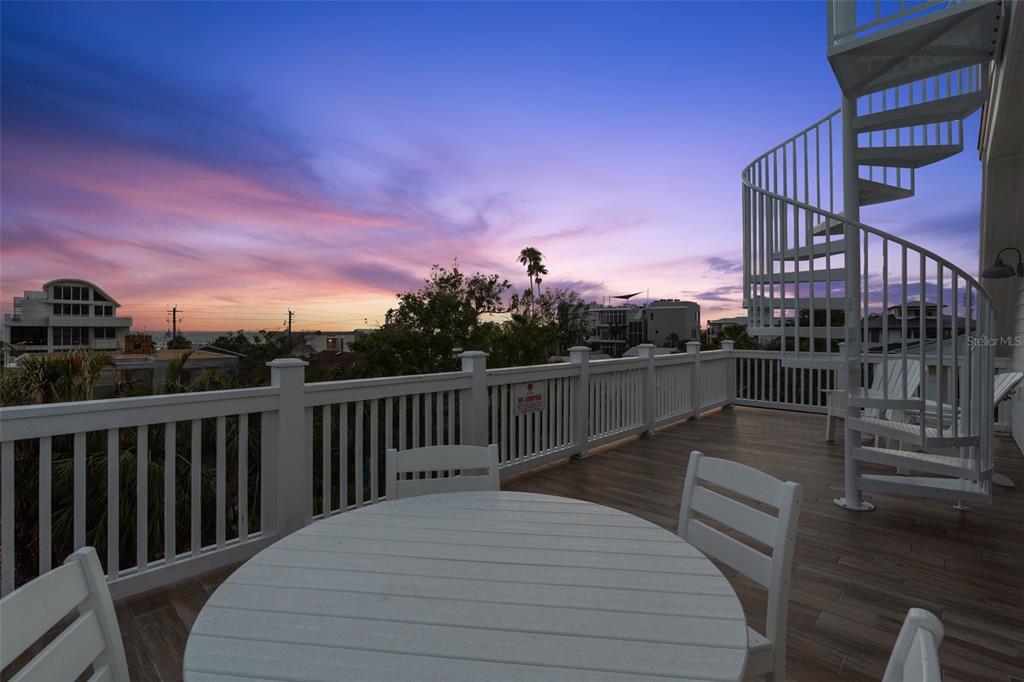 538 Canal Road Sarasota, FL 34242 - Photo 15 of 49 a balcony with wooden floor