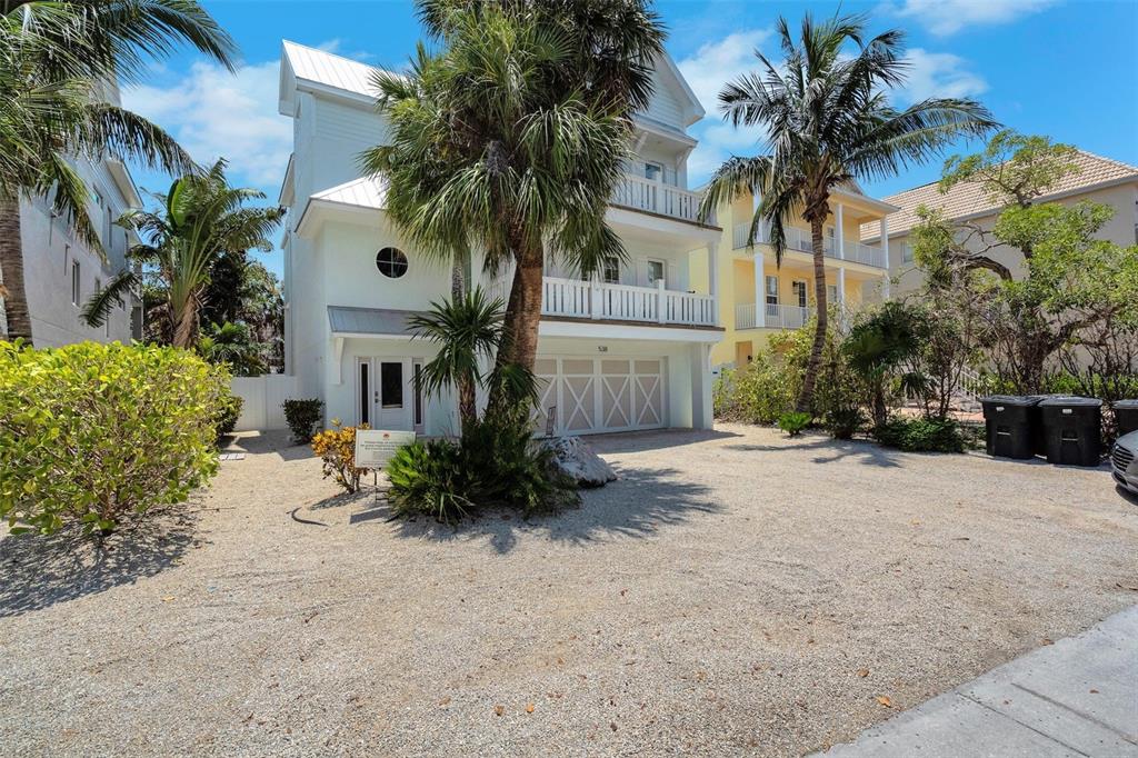 538 Canal Road Sarasota, FL 34242 - Photo 17 of 49 a front view of a house with a yard and a garage