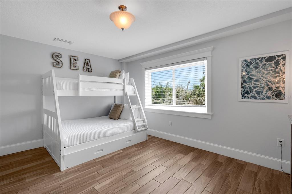 538 Canal Road Sarasota, FL 34242 - Photo 18 of 49 a bedroom with a bed and a large window