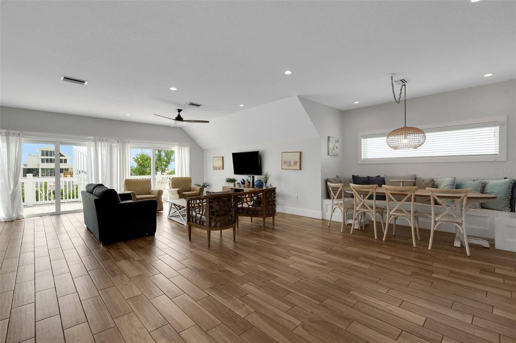 538 Canal Road Sarasota, FL 34242 - Photo 19 of 49 a view of a dining room with furniture window and wooden floor