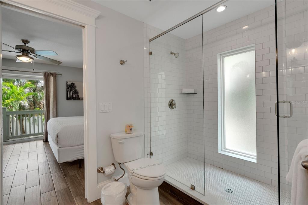 538 Canal Road Sarasota, FL 34242 - Photo 24 of 49 a bathroom with a toilet a sink and shower