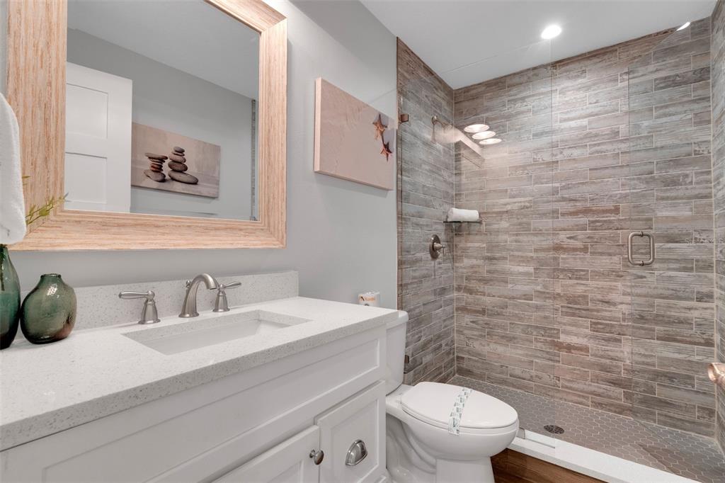 538 Canal Road Sarasota, FL 34242 - Photo 30 of 49 a bathroom with a sink a toilet and shower curtain